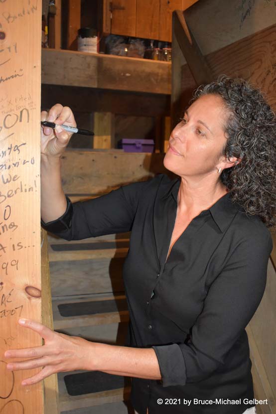 Dana Goldberg signs the Community House dressing room wall - photo by Bruce-Michael Gelbert