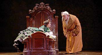 Andrea Goss (Christmas Present) and Joel McKinnon Miller (Ebenezer Scrooge) in McCarter Theatre Center's "A Christmas Carol"  Photo by T. Charles Erickson