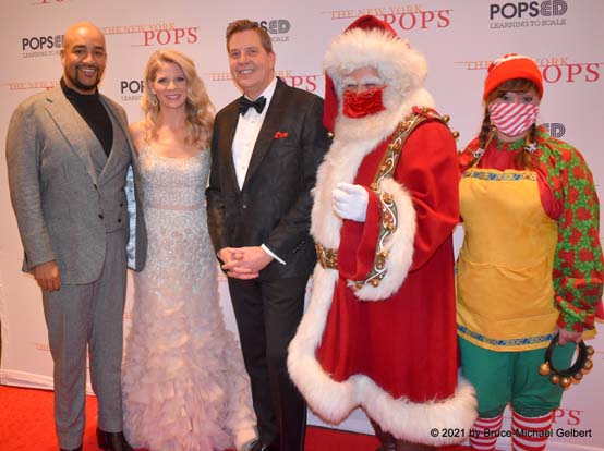 (left to right) Brandon Michael Nase, Kelli O'Hara, Steven Reineke, Santa Claus & elf - photo by Bruce-Michael Gelbert