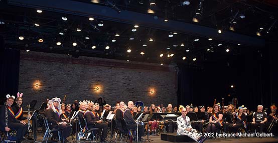 the Lesbian & Gay Big Apple Corps Symphonic Band, with conductor Henco Espag, seated on the podium - photo by Bruce-Michael Gelbert